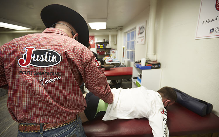 A member of the Justin Sportsmedicine Team® working on a patient. 